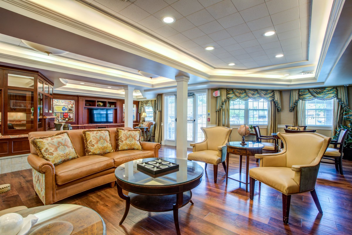 A luxurious living room with elegant furniture and hardwood flooring.