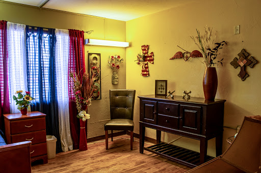 A cozy living room corner featuring elegant furniture and decorative elements.