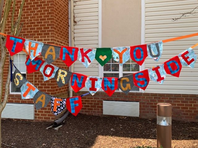 A colorful banner displayed outside, expressing gratitude to the Morningside staff.