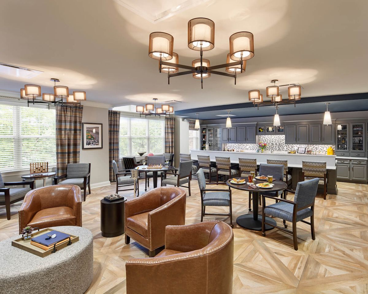 A modern lounge area with comfortable seating and elegant lighting.