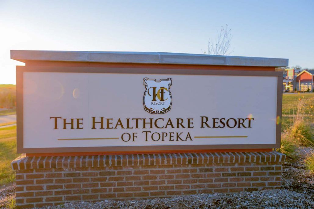 A sign for The Healthcare Resort of Topeka.