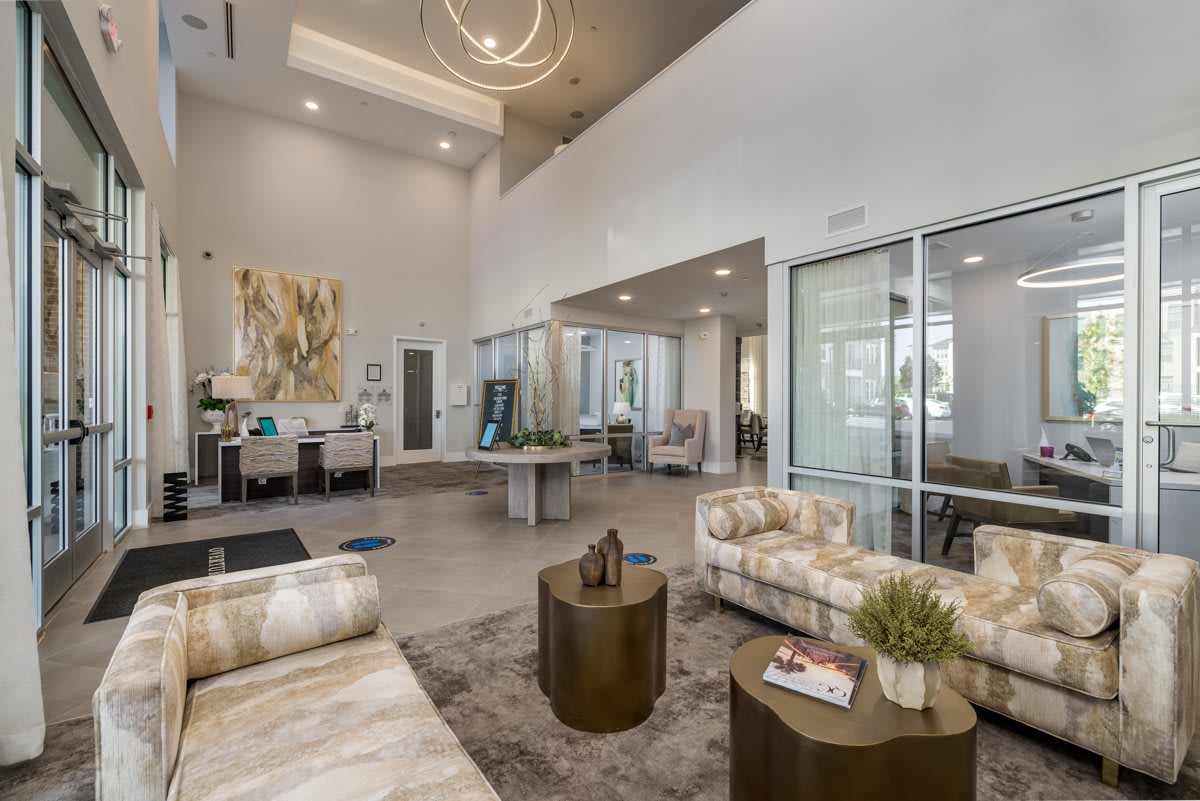 A modern lobby with stylish furniture and decor.