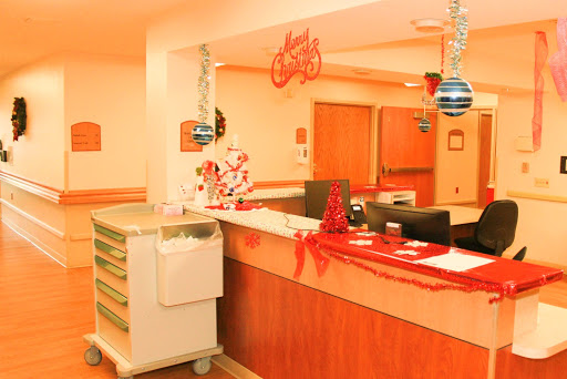 A festively decorated hospital reception area ready for the holiday season.