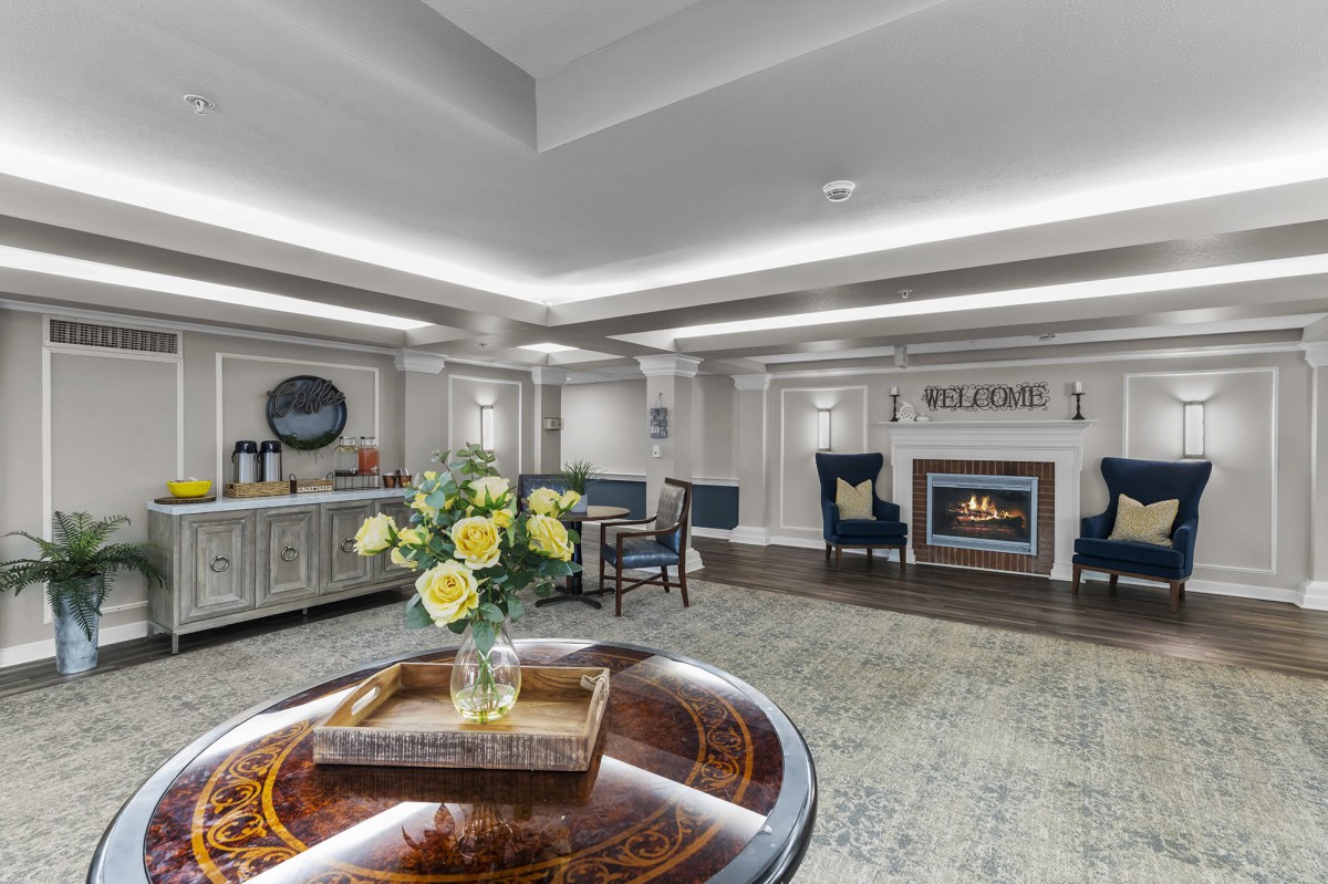 A stylish lobby with comfortable seating and a cozy fireplace.
