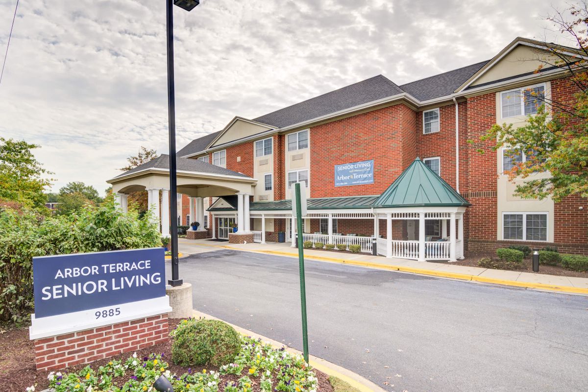 A senior living facility with a brick exterior and covered entrance.