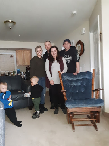 A joyful family gathering in the living room.