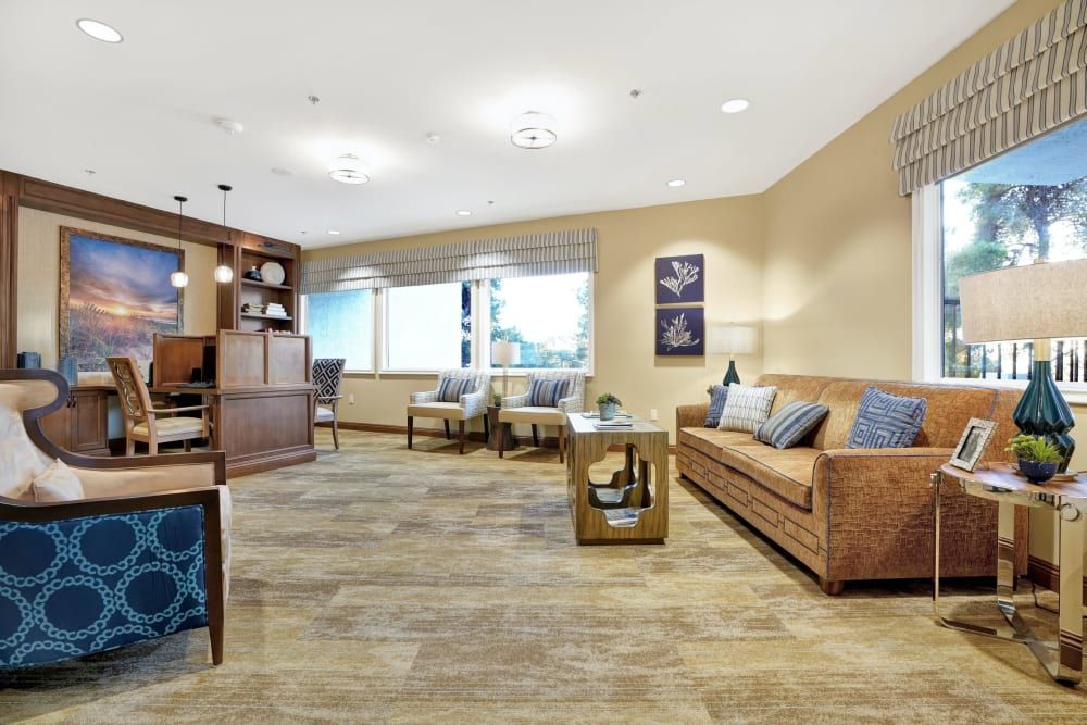 A modern living room with comfortable seating, wooden flooring, and tasteful decor.