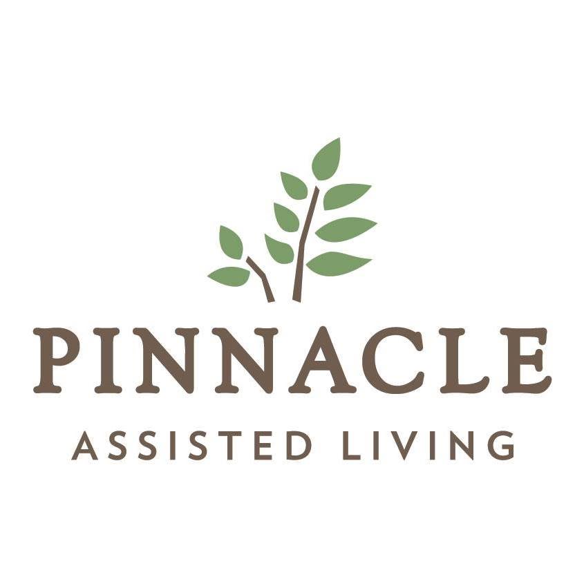 Logo for Pinnacle Assisted Living featuring green leaves.