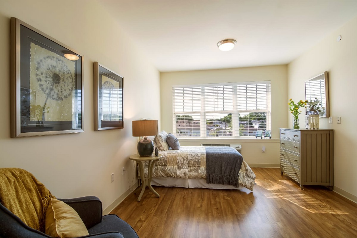 Bright and cozy bedroom with natural light and modern decor.