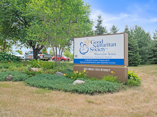 The entrance sign of the Good Samaritan Society, surrounded by well-maintained landscaping.