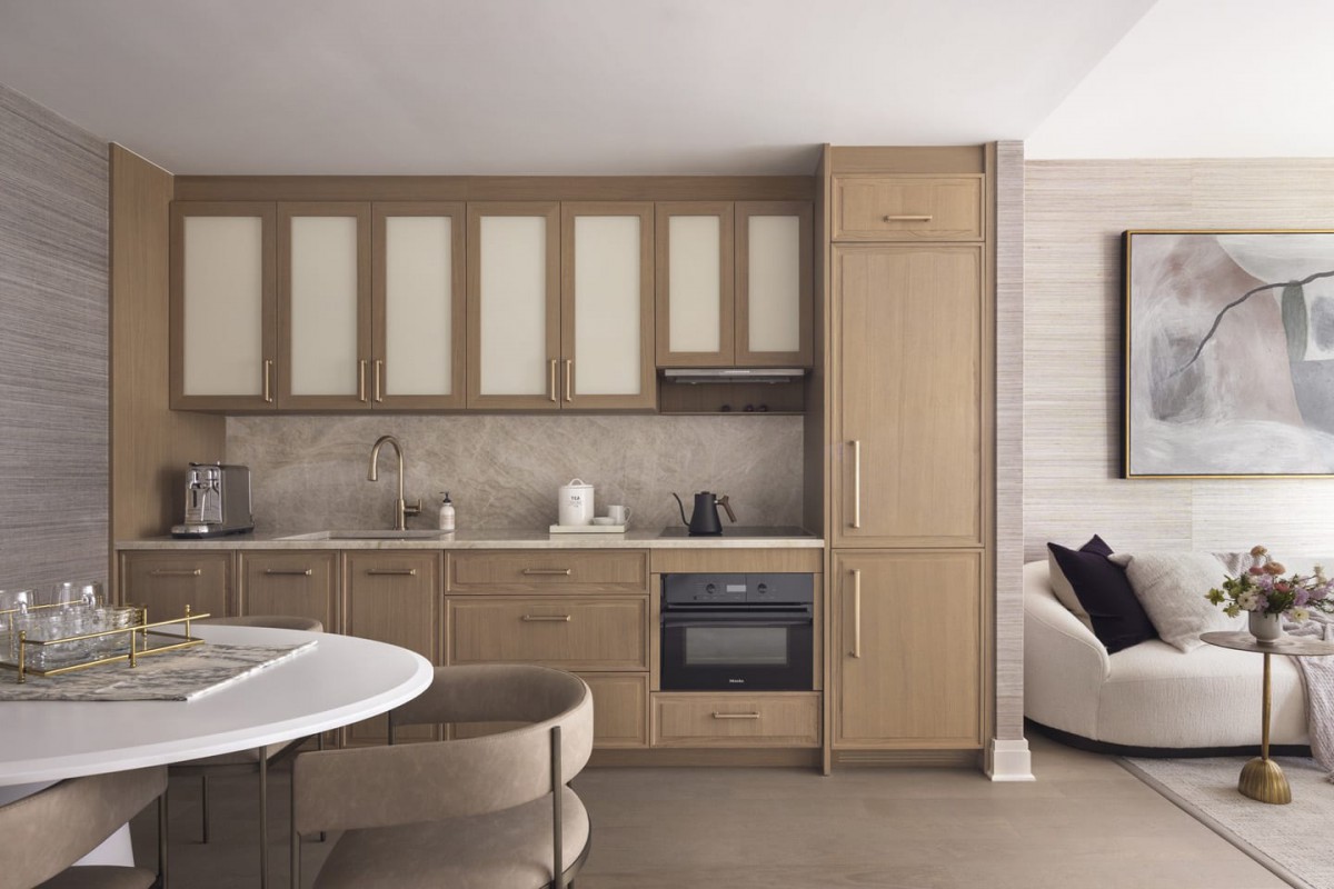 Modern kitchen with wooden cabinetry and minimalist design.