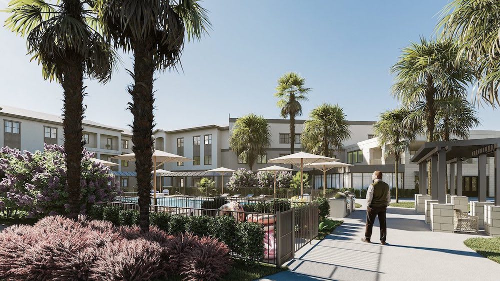 A sunny day at a modern resort featuring a swimming pool and outdoor leisure area surrounded by palm trees.
