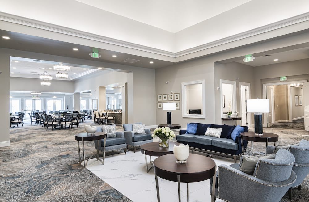 Modern hotel lobby with stylish seating area and contemporary decor.