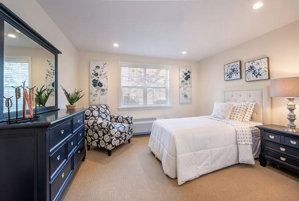 A cozy and well-decorated bedroom with a comfortable bed and stylish furniture.