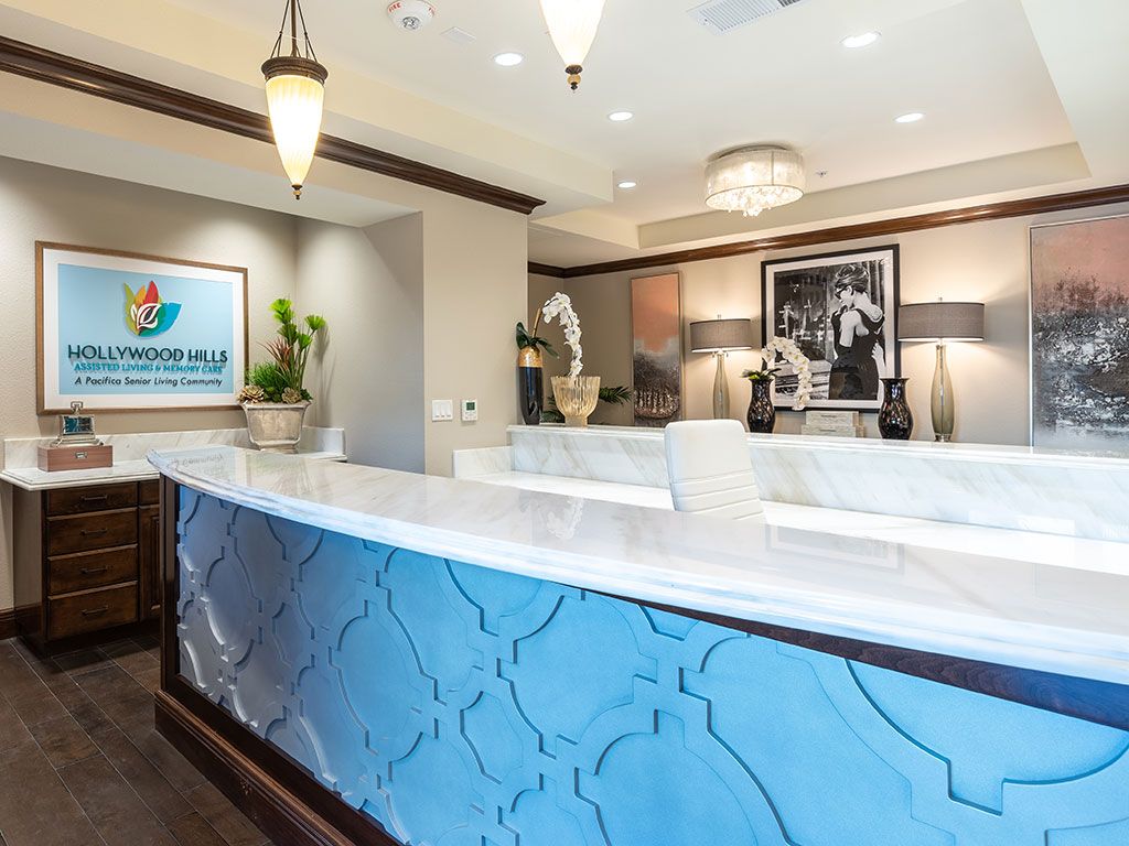 A modern reception desk area with elegant lighting and decor.