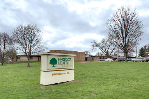 The Heritage Health facility, set against a cloudy backdrop.