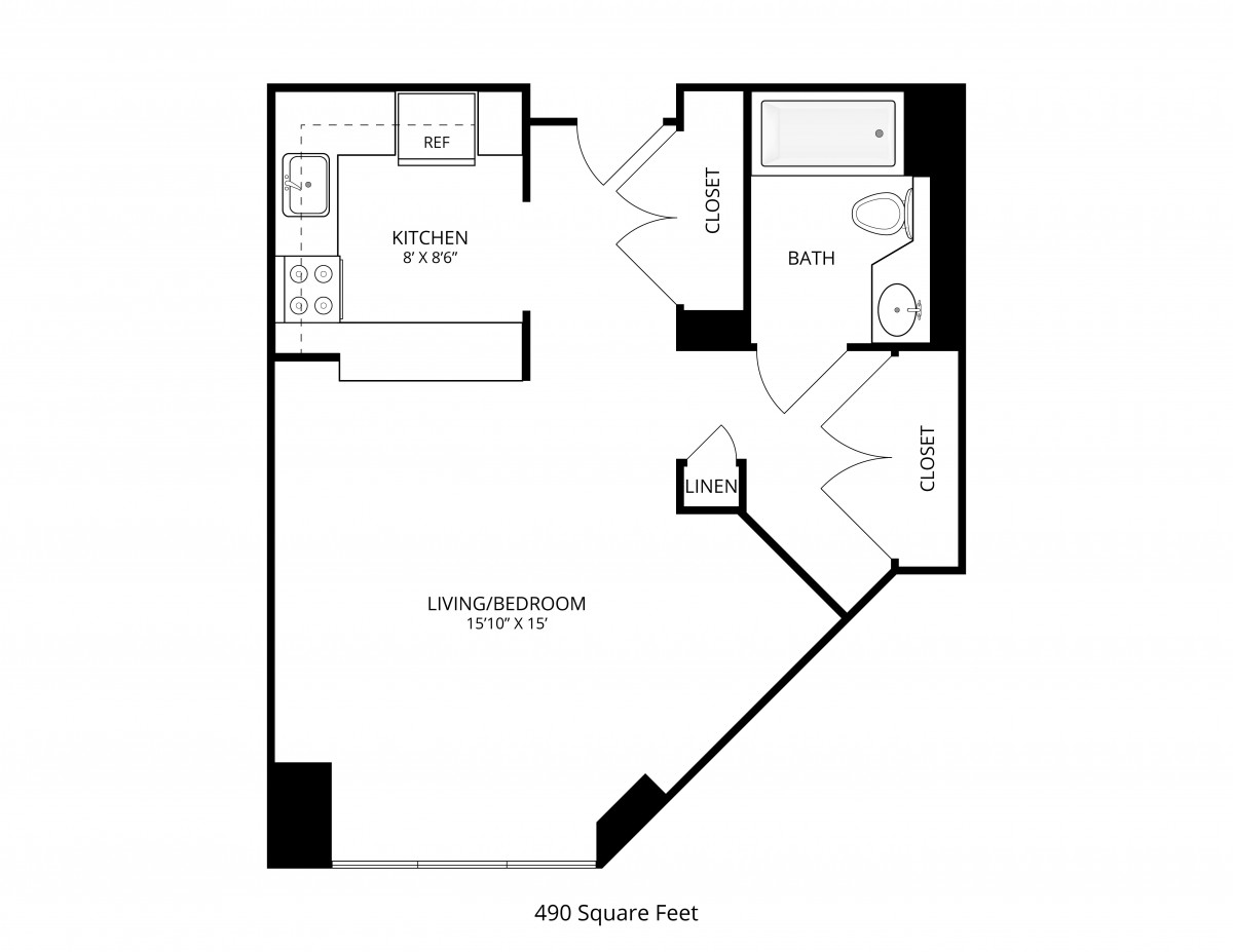 A studio apartment floor plan featuring a kitchen, living/bedroom area, and one bathroom.