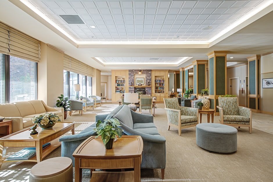 A spacious and modern lobby area with comfortable seating and decorative indoor plants.