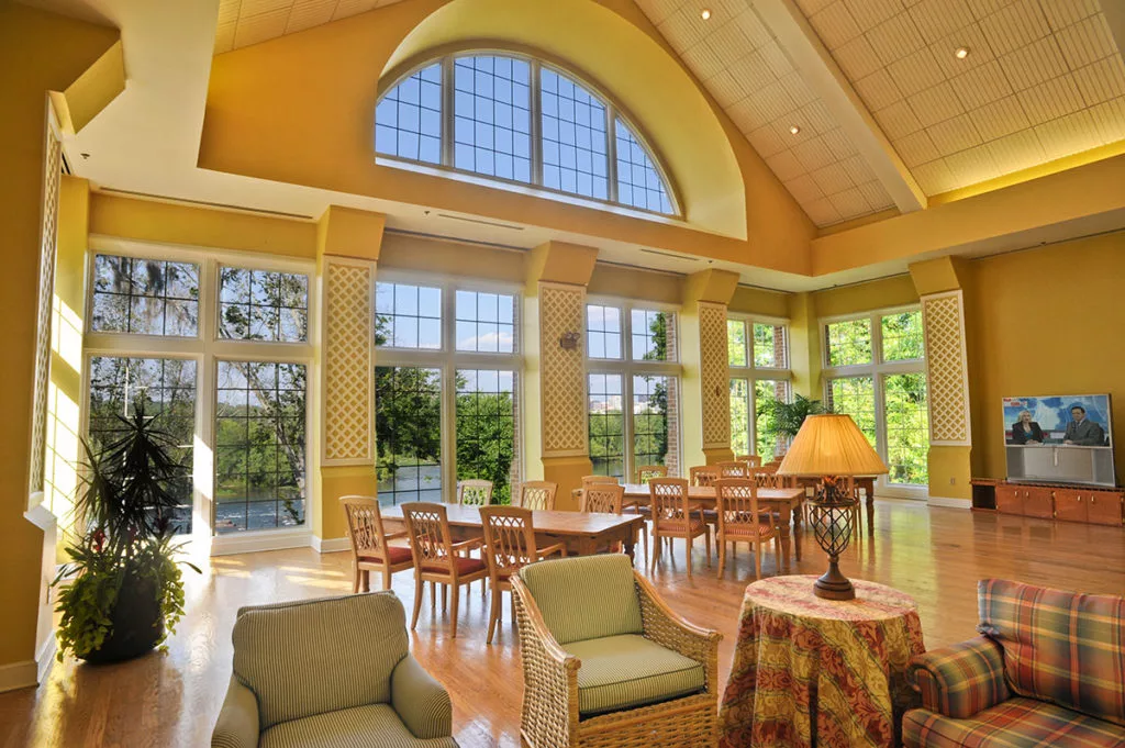 Spacious living and dining area with large windows and abundant natural light.