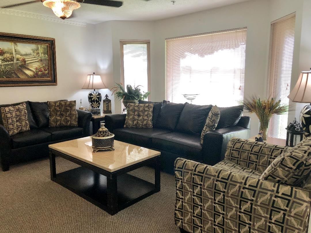 A modern living room featuring comfortable sofas, a stylish coffee table, and elegant decor.