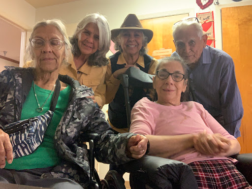 A joyful gathering of friends and family, celebrating together indoors.