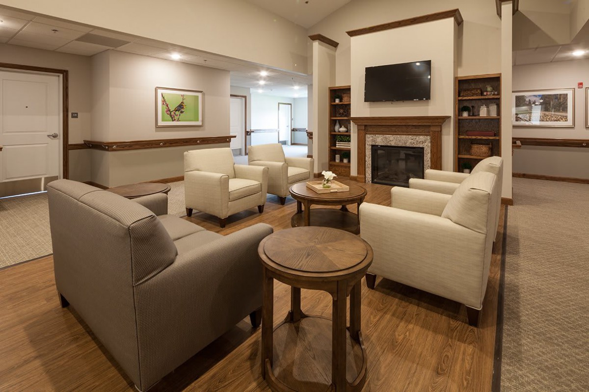 A cozy living room with comfortable seating and a fireplace.