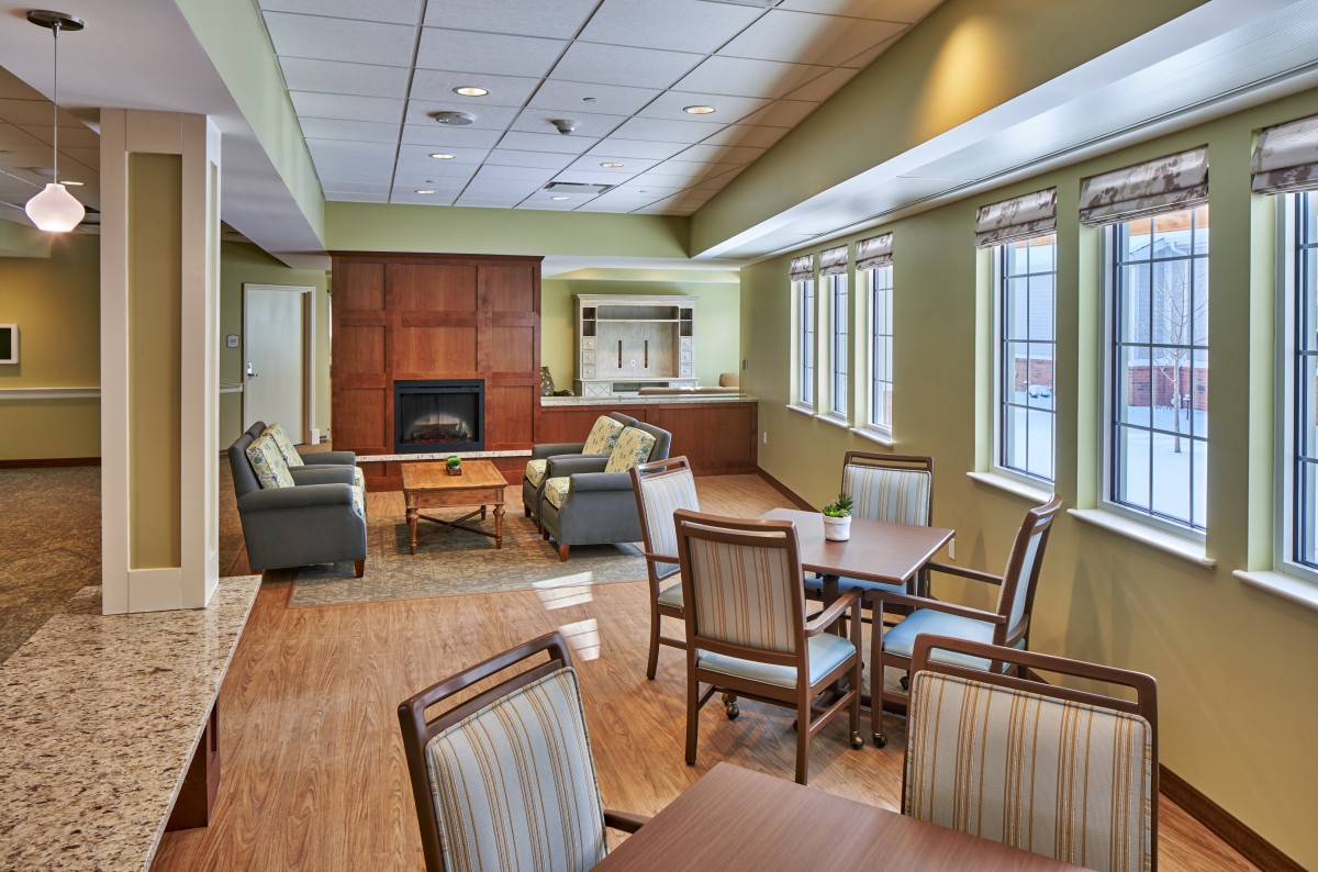 A cozy lounge area with comfortable seating and natural lighting.