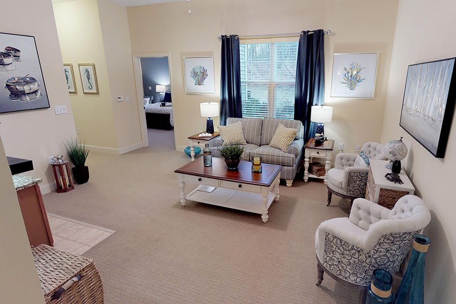 A cozy living room with comfortable seating, a coffee table, and stylish decor.