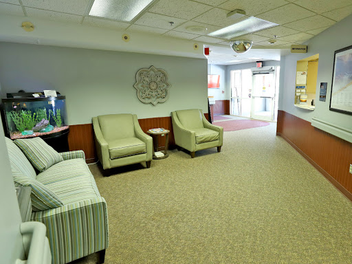 A cozy waiting area featuring comfortable chairs and a welcoming atmosphere.