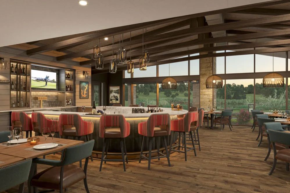A modern restaurant interior with a central bar and cozy seating area featuring wooden accents and large windows.