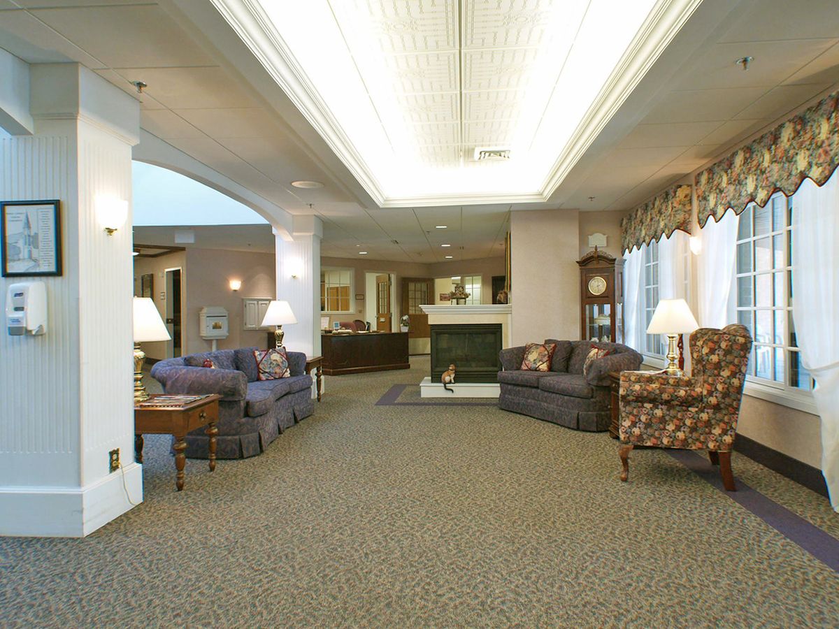 A spacious lobby with comfortable seating and soft lighting.