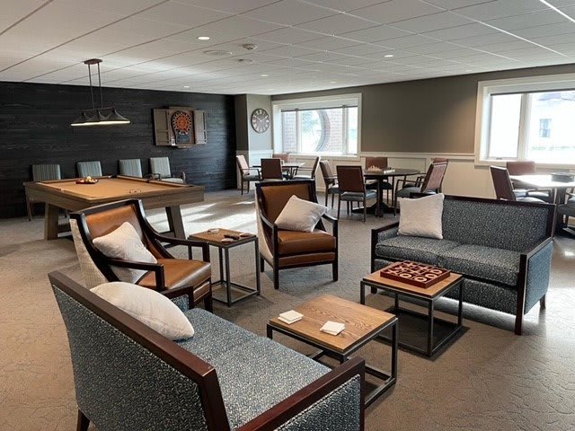 A modern lounge area with comfortable seating and stylish decor.