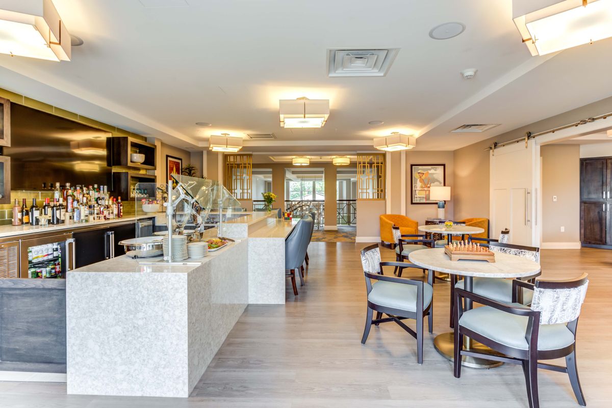 A modern and luxurious open-concept kitchen and dining area.