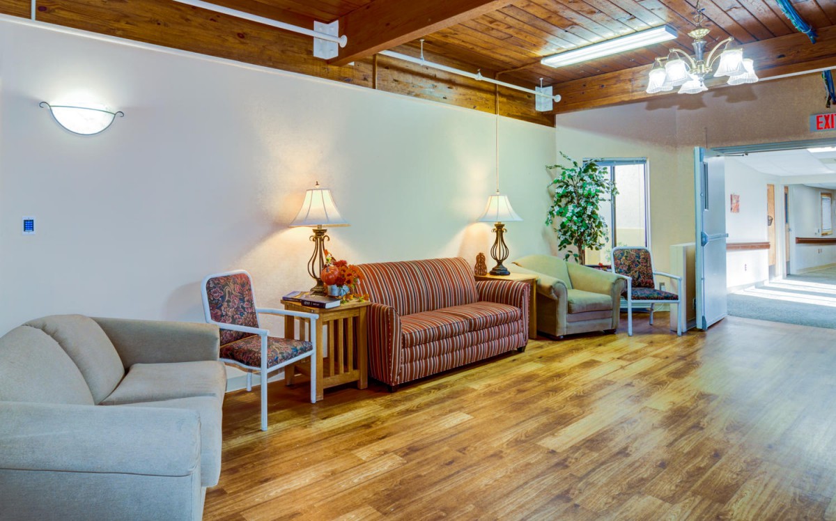 A cozy living room with comfortable seating and warm lighting.