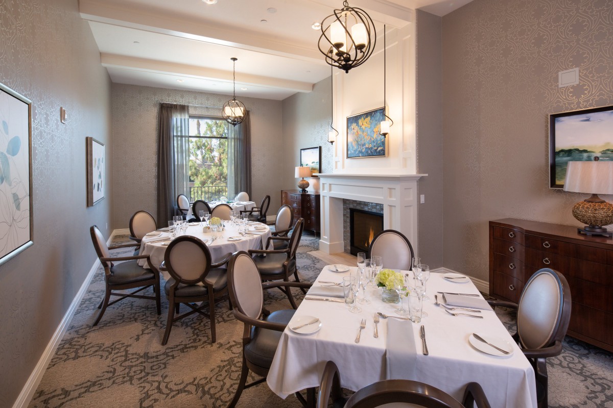 A sophisticated dining room with elegantly set tables and classic decor.