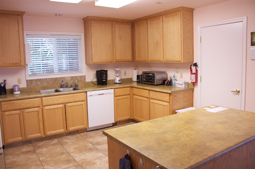 A well-equipped kitchen featuring wooden cabinets and modern appliances.