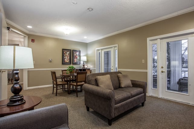 Cozy living room with a sofa and dining area.