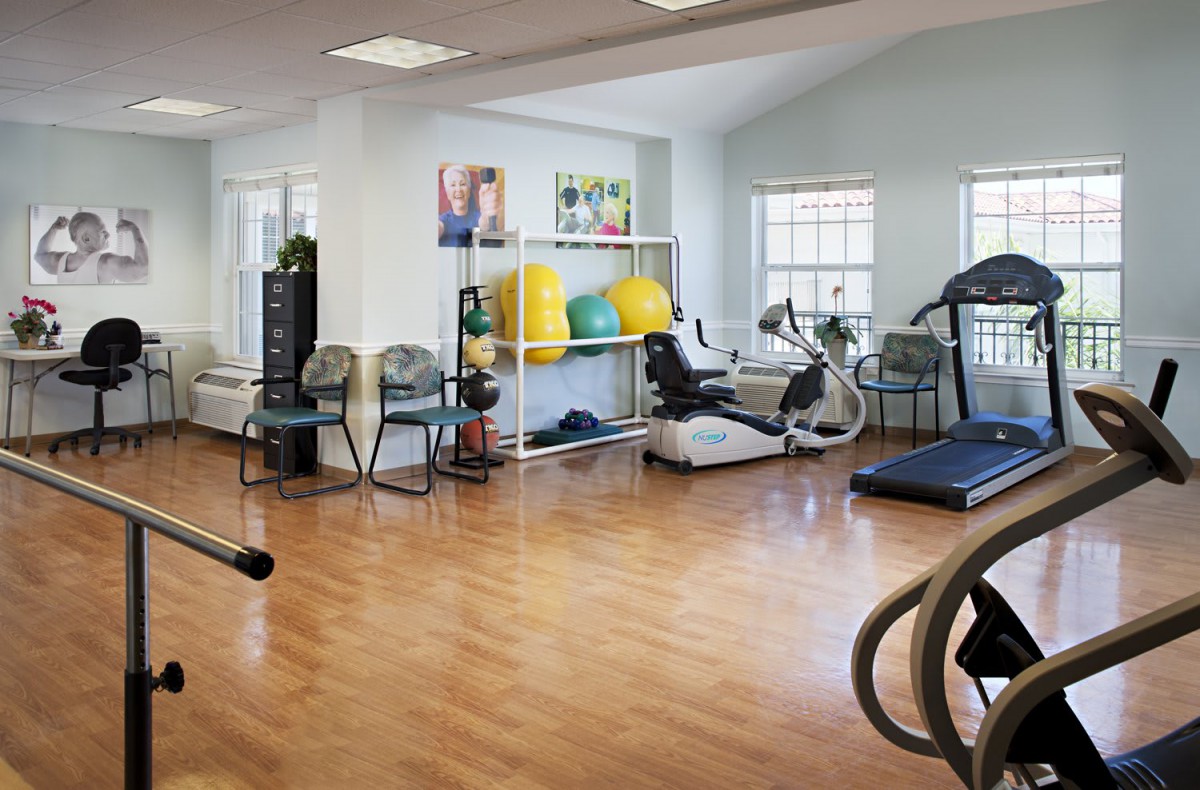 A well-equipped gym with various exercise machines and fitness equipment.
