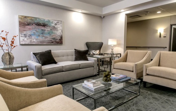 A cozy, well-decorated living room featuring comfortable seating and modern decor.