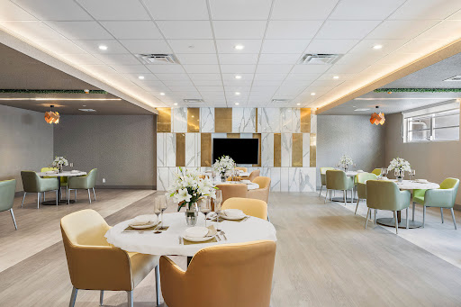 A modern and elegant dining area set for a meal, showcasing stylish decor and contemporary furnishings.