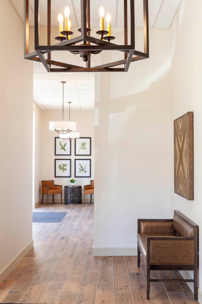 A modern hallway with decorative artwork and stylish lighting.