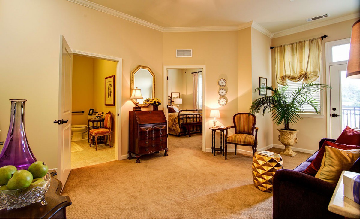 A cozy and well-decorated living room with elegant furniture and soft lighting.
