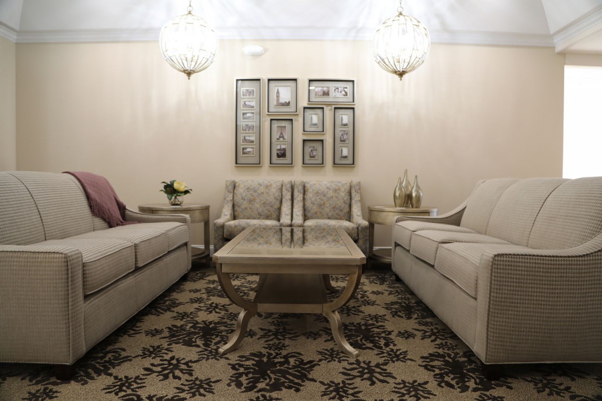 A cozy living room with elegant furniture and decor.