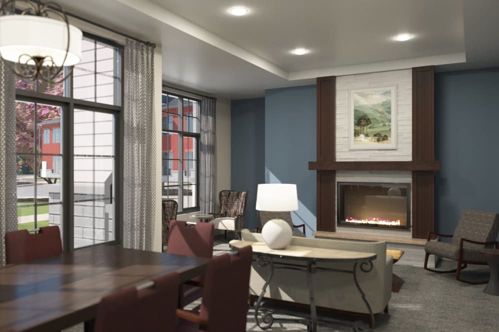A cozy and stylish living room featuring a fireplace, comfortable seating, and large windows.