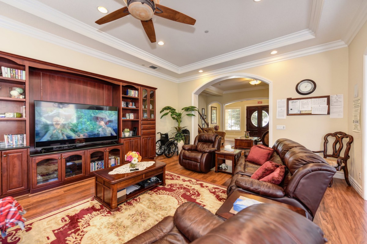 A cozy living room with comfortable seating, a large television, and stylish decor.