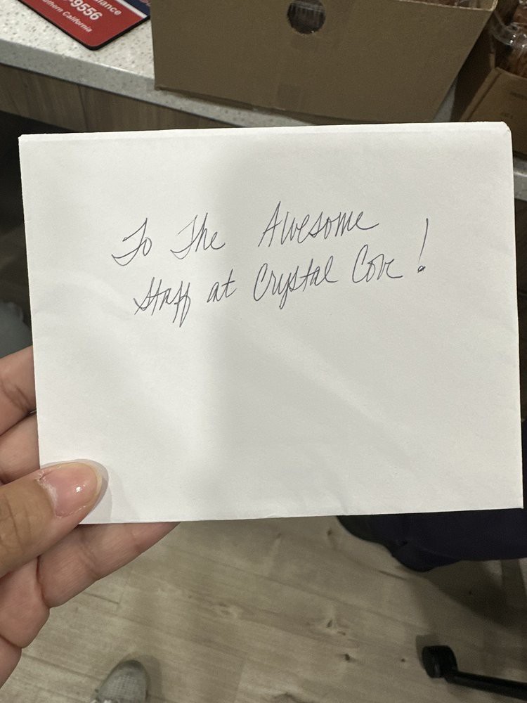 A handwritten message on an envelope reads: 'To the Newest Hero at People Co!'