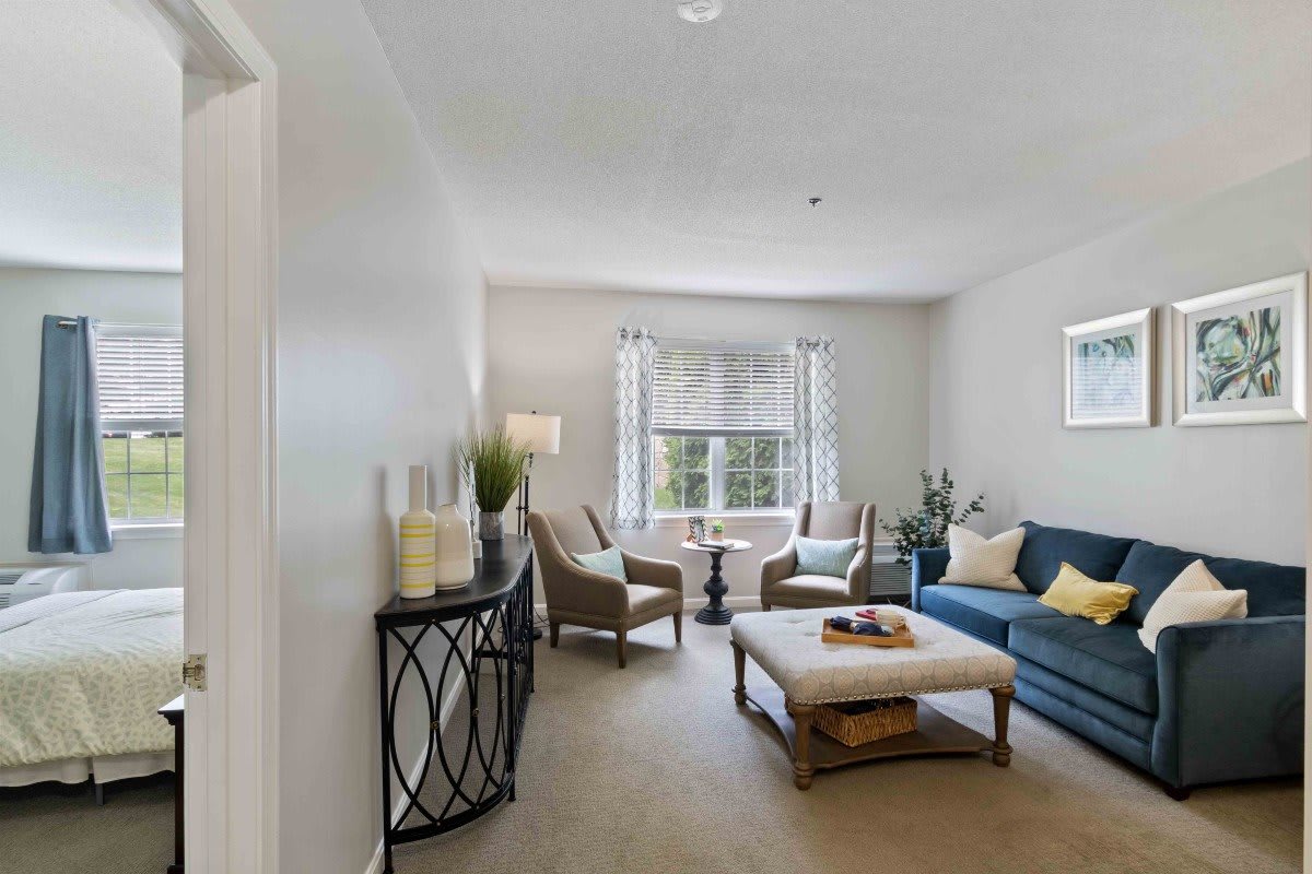 A bright living room featuring comfortable seating and elegant decor with ample natural light.