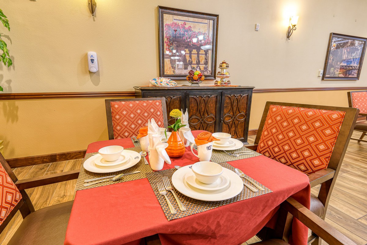 A well-arranged dining table with decorative elements in a cozy dining room.