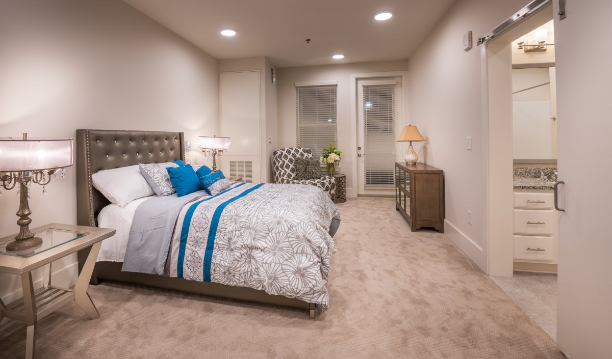 A modern bedroom with stylish decor and comfortable furnishings.