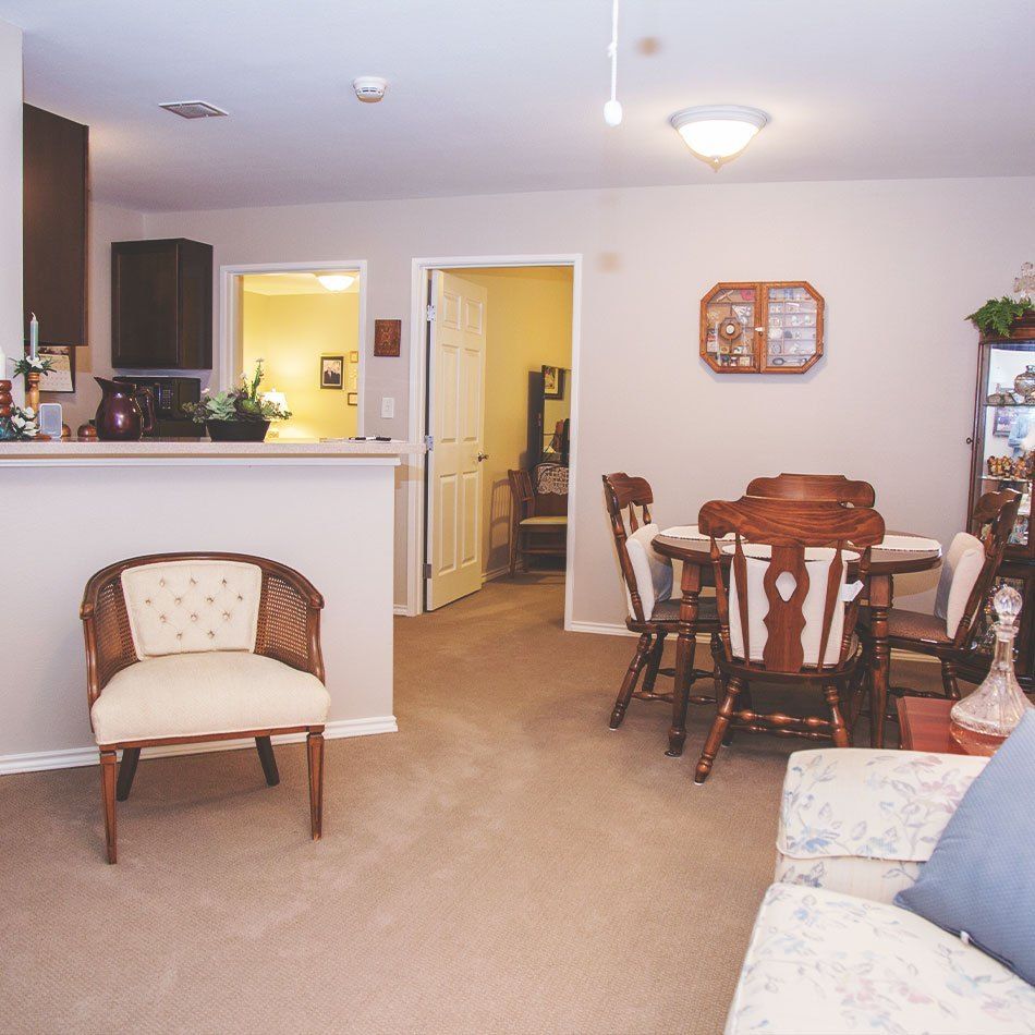 A cozy living and dining area with traditional furniture and homey decor.